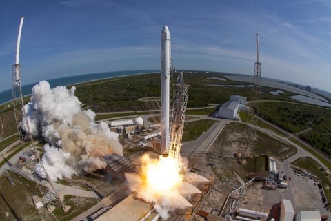 SpaceX Falcon 9 rocket and Dragon spacecraft lift off from Launch Complex 40 at the Cape Canaveral 